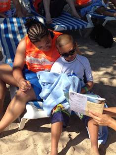 Staff with kid beach