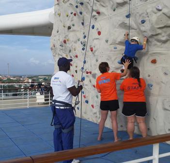 Staff help kid Rock Wall