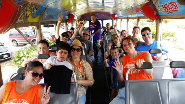 staff on bus to beach