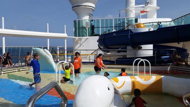 staff with kids at pool